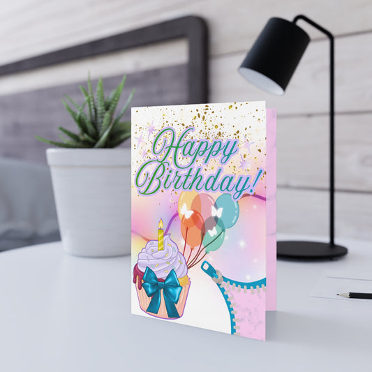 Birthday card with cupcake, balloons, and lingerie illustration.