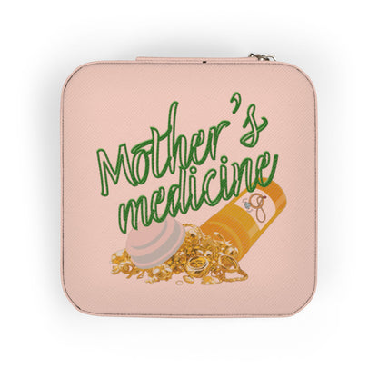 Pink jewelry box with "Mother's Medicine" and spilled pills and jewelry.