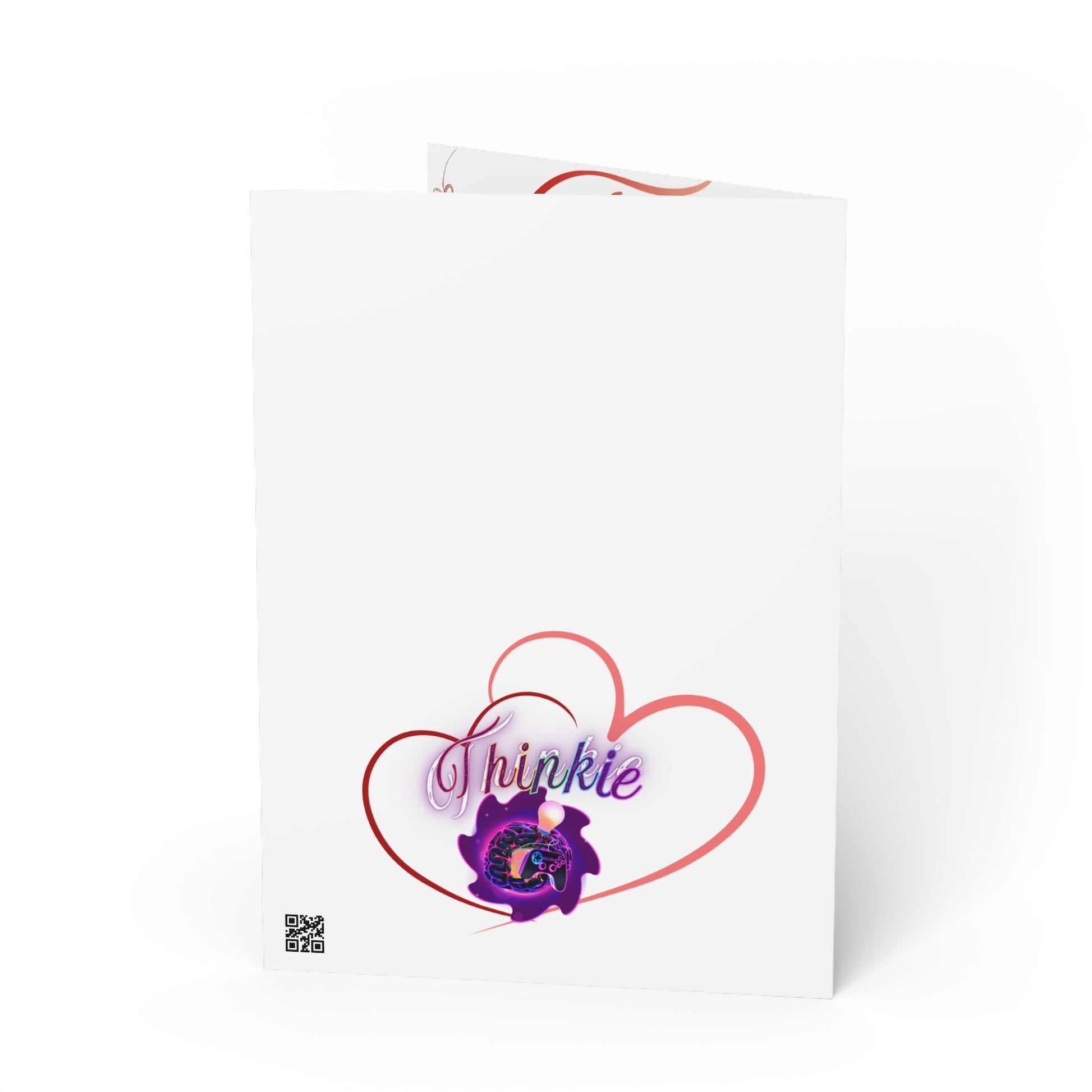Folded greeting card with "Thinkie" logo inside red heart outline.