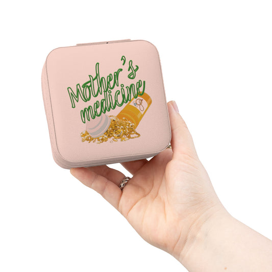 Pink jewelry box with "Mother's medicine" and jewelry.
