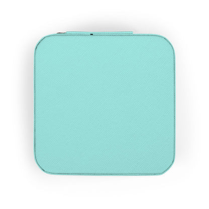 Turquoise zippered jewelry case with textured surface.