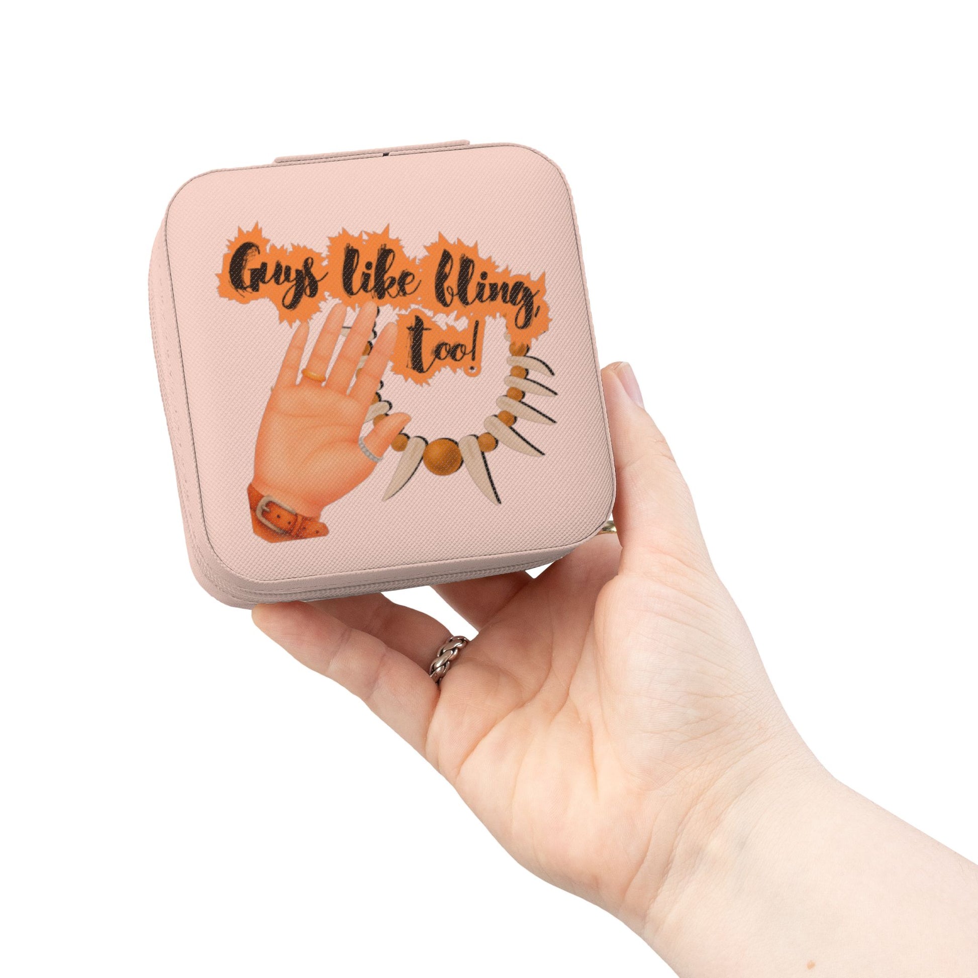 Pink jewelry box with "Guys like bling too!" text and a hand holding it.