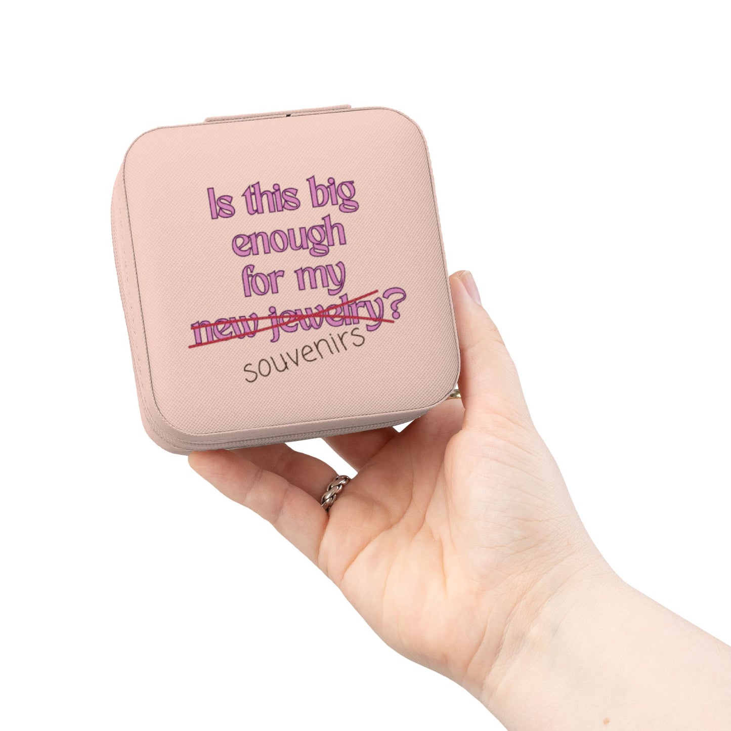Pink jewelry box with text reading "Is this big enough for my new jewelry? Souvenirs".