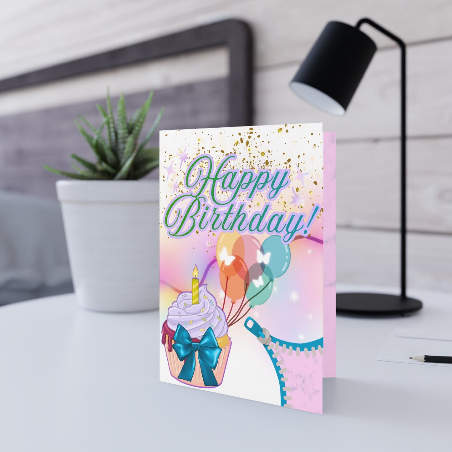 Birthday card with cupcake, balloons, and lingerie illustration.