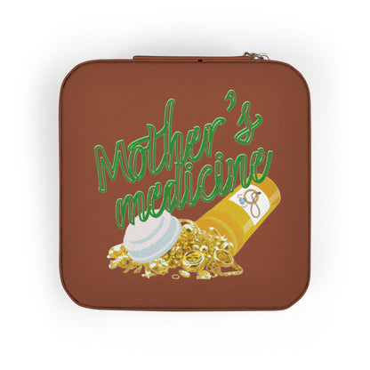 Brown case with "Mother's Medicine" text and pill bottle spilling pills.